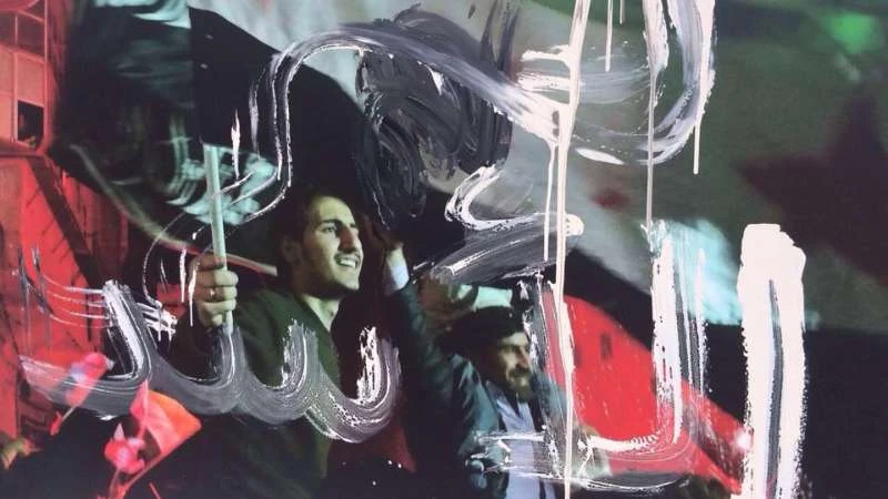 بالصور .. "شبيحة الأسد" يعتدون على معرض للصور في جنيف