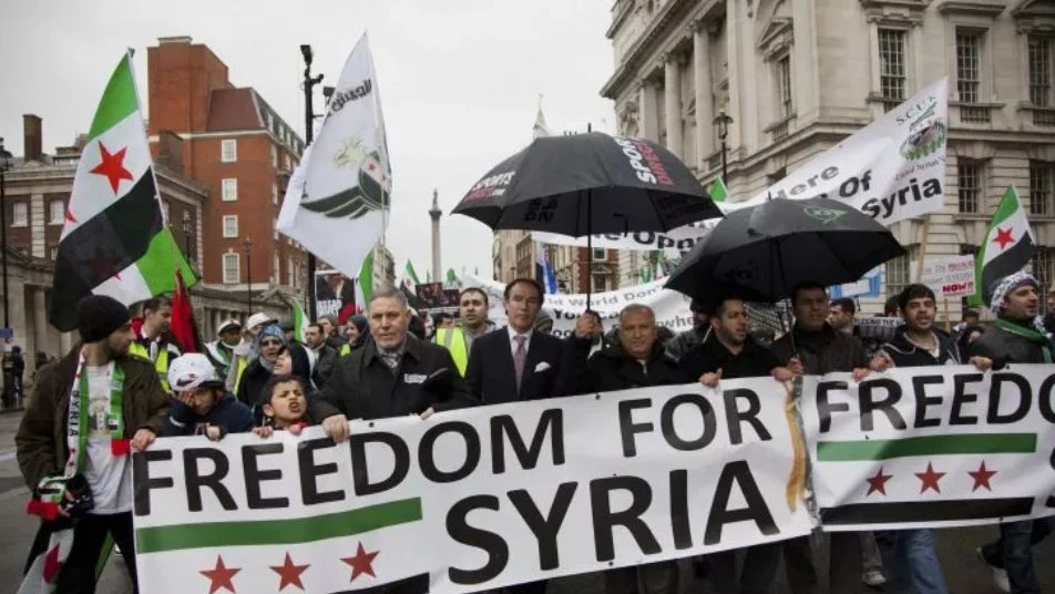 مجلة أمريكية تُحرج بايدن بعنوان وصورة للأسد وبلينكن يسارع للرد
