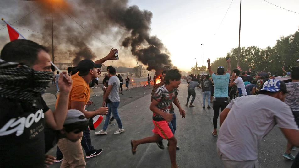 21 قتيلاً في بغداد والاحتجاجات تطيح برئيس الوزراء عادل عبد المهدي