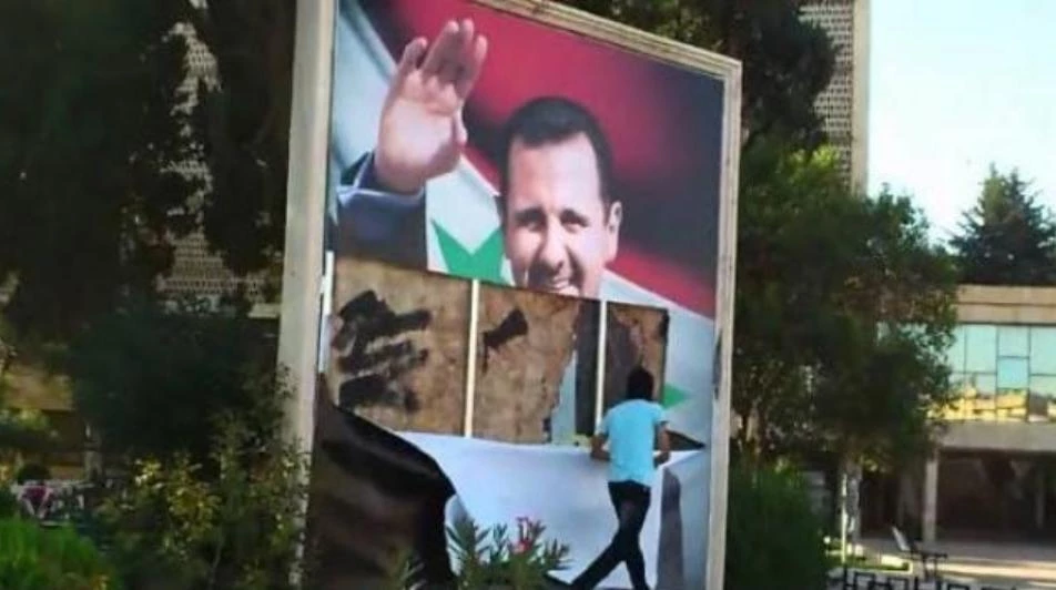 ناشطو السلمية يؤرقون نظام أسد ويجبرونه على إزالة صور بشار (صور)