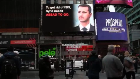 "Citizens for Safe and Secure America" rents video billboard in Times Square displaying Assad and his allies’ crimes