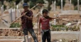 Two Syrian children dig graves to survive in Idlib