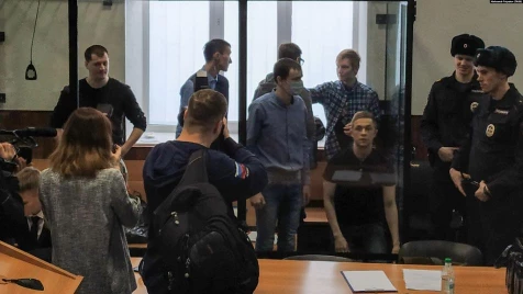 Russian court jails seven activists