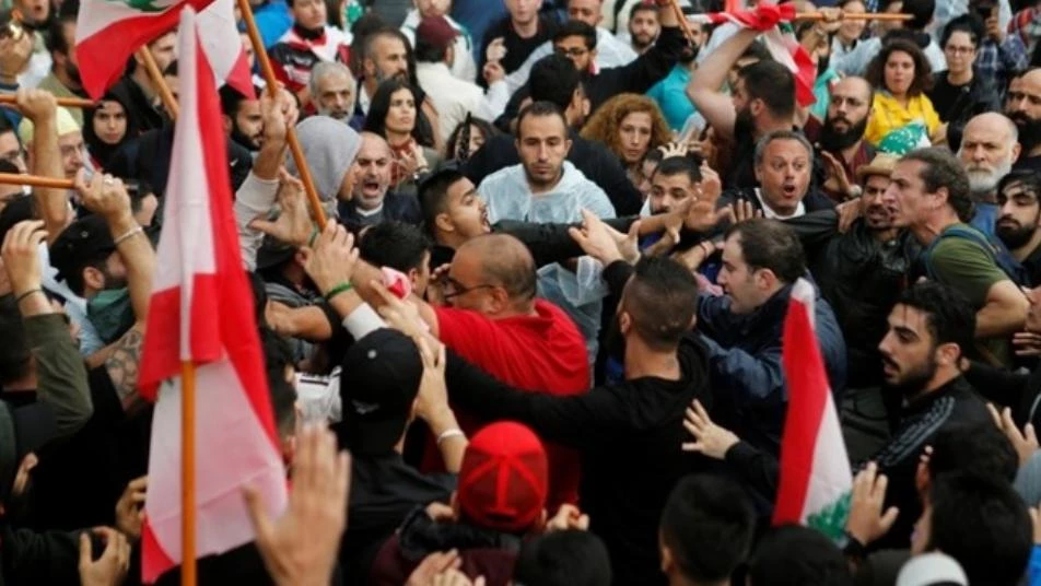 Hezbollah supporters scuffle with protesters in Beirut