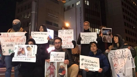 On New Year's Eve, Activists protest Putin crimes in front of Russian embassy in Japan