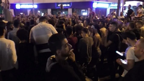 Lebanese continue protesting into the night across the country