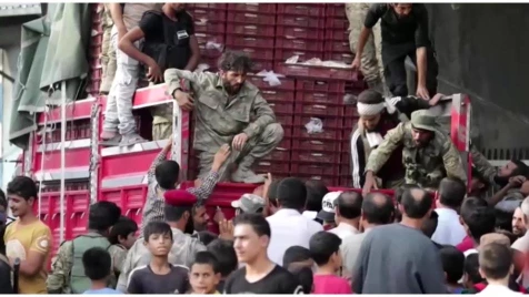 Turkey-backed opposition distributes bread to civilians in Tel Abyad