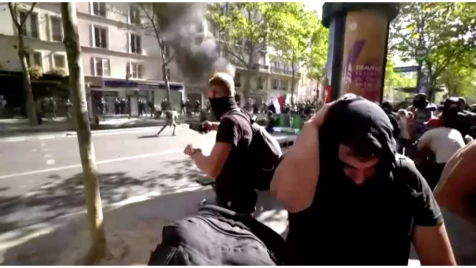 Climate change march turns to violence as police clash with protesters in central Paris