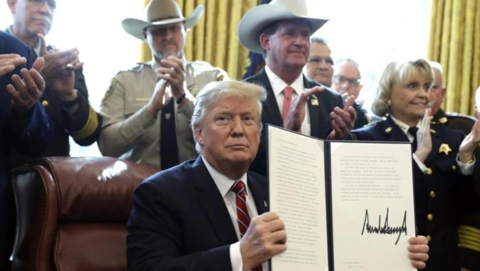 Trump signs his first veto
