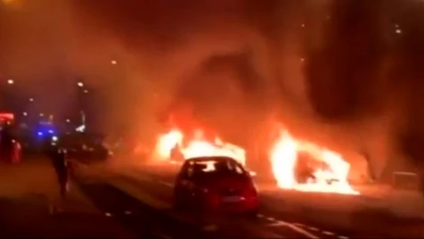 Cars ablaze outside France's Le Parisien newspaper building
