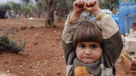Heartbreaking story behind photo of four-year-old Syrian girl ‘surrendering’ 